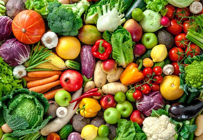 Fresh colourful vegetables — tomatoes, broccoli, peppers, carrots