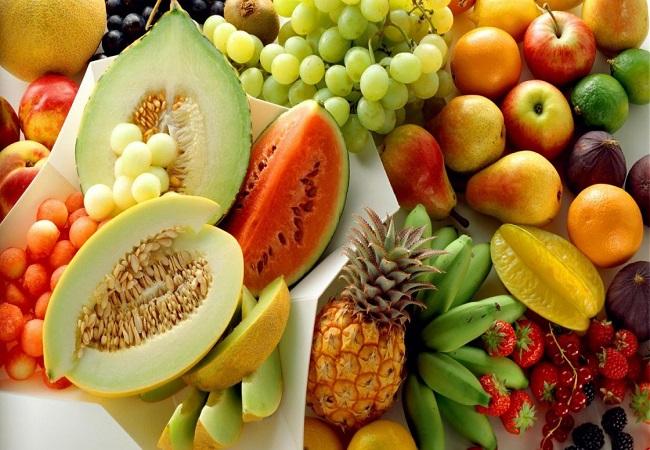 Fresh tropical fruits — mangoes, grapes, papaya, pineapple